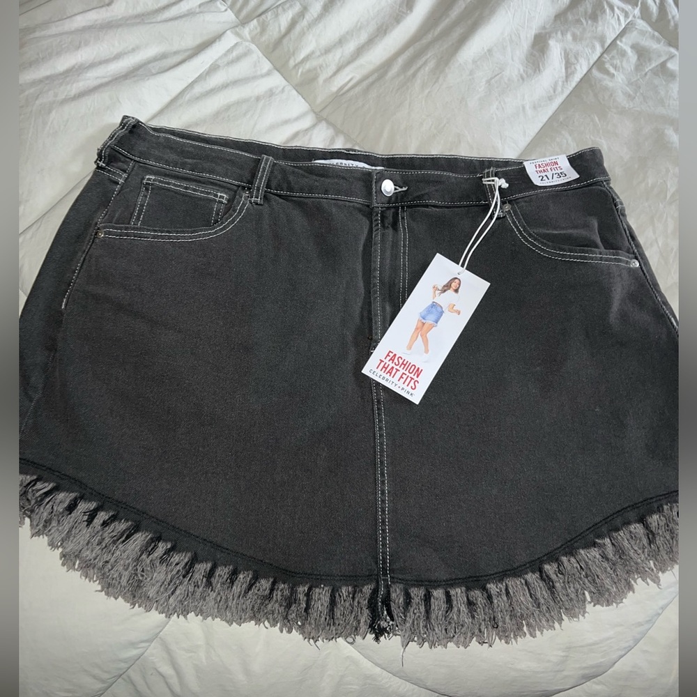 Super cute black jean skirt with fringe